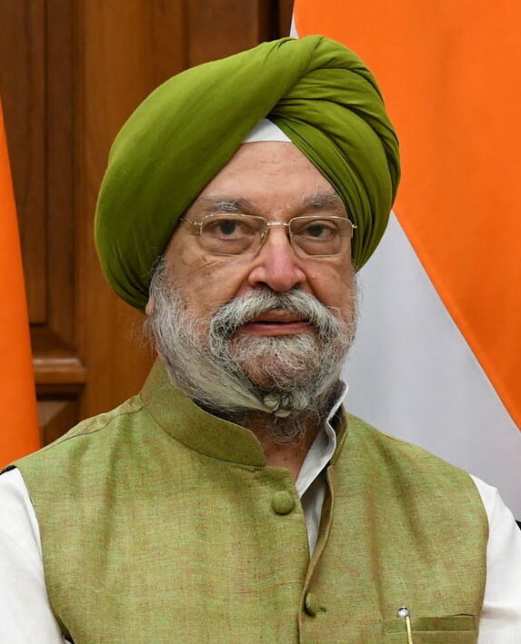 Portrait of Hardeep Singh Puri in a green turban and green waistcoat